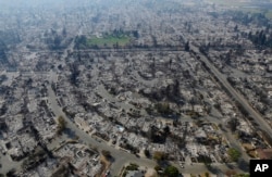 Homes burned by a wildfire are seen, Oct. 11, 2017, in Santa Rosa, California.