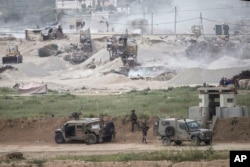 Israeli soldiers are seen near the Gaza border, March 28, 2018.