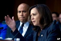 Sen. Kamala Harris D-Calif., accompanied by Sen. Cory Booker D-N.J., questions Homeland Security Secretary Kirstjen Nielsen during a hearing, Jan. 16, 2018, in Washington.
