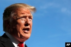 FILE - President Donald Trump speaks to the media outside the White House, April 27, 2019.