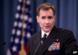 FILE - Rear Admiral John Kirby, the Defense Department spokesman, talks to reporters at the Pentagon.