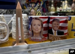 Coffee mugs for sale in Washington bear likenesses of presidential nominees Hillary Clinton and Donald Trump.