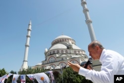 Recep Tayyip Erdogan, Turkey's president and ruling Justice and Development Party leader, addresses his supporters during an election rally in Istanbul, June 15, 2018.