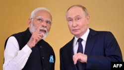 Russian President Vladimir Putin and Indian Prime Minister Narendra Modi attend a ceremony to decorate India's PM with the Order of St. Andrew the Apostle the First-Called following their talks at the Kremlin in Moscow on July 9, 2024. (Photo by Alexander