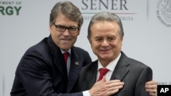 U.S Energy Secretary Rick Perry embraces Mexico's Secretary of Energy Pedro Joaquin Coldwell, after they made a joint statement in Mexico City, July 13, 2017. 
