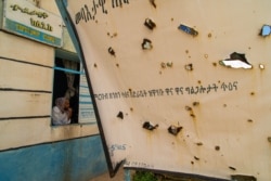 Nurse Tefetawit Tesfay waits for patients in her damaged and looted clinic in Edaga Hamus, a small town that has been the stage of battles during the ongoing conflict in the Tigray Region, in Ethiopia, on June 5, 2021. (Yan Boechat/VOA)