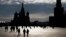 FILE - People walk through Red Square in Moscow.