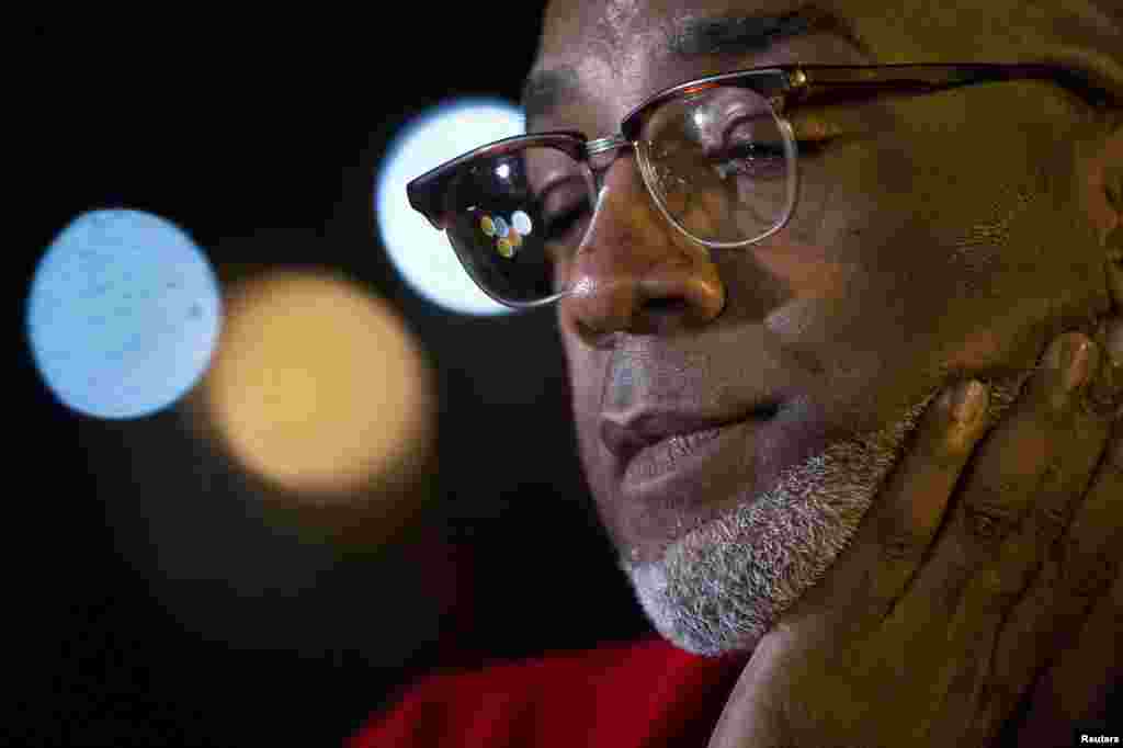 Riqui Lawrence speaks to the media about his concerns after it was confirmed that his neighbor, Dr. Craig Spencer, tested positive for Ebola upon returning from West Africa where he treated Ebola patients, New York, Oct. 23, 2014. 