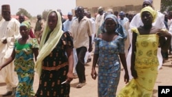 Four girls returned to the families after gumen kidnapped more than 200 girls from a northern Nigeria school, Chibok, April, 21 2014.