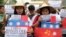 Filipino student activists hold mock Chinese ships to protest recent island-building and alleged militarization by China off the disputed Spratlys group of islands in the South China Sea during a rally near the Malacanang presidential palace in Manila, Ph