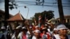 FILE - Protesters gather in front of the Appeals Court during a protest near the Royal Palace in central Phnom Penh, February 10, 2014.