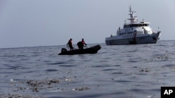 Rescuers search for victims of Lion Air passenger jet that crashed in the waters of Ujung Karawang, West Java, Indonesia, Monday, Oct. 29, 2018.