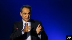Greece's Prime Minister Kyriakos Mitsotakis addresses journalists during a news conference in the northern city of Thessaloniki, Sept. 13, 2020.