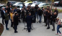 Hungarian Prime Minister Viktor Orban speaks to journalists at a polling station in Budapest, Oct. 13, 2019, after he cast his vote in local elections.
