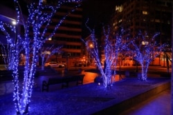 Streets sit largely deserted as National Guard personnel and police close off a block, Sunday, Jan. 17, 2021, in Washington, as part of increased security ahead of the inauguration of President-elect Joe Biden and Vice President-elect Kamala Harris.