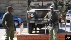FILE - Army personnel are seen outside the military headquarters in Maseru, Lesotho.