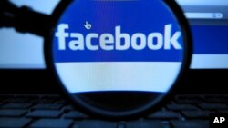 FILE - Facebook security officials say they found fake account had bought advertising for divisive social issues. The company said the accounts were likely based in Russia. (AP Photo/dapd, Joerg Koch)