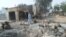 A man walks past burnt out houses following an attack by Boko Haram in Dalori village 5 kilometers (3 miles) from Maiduguri, Nigeria, Jan. 31, 2016.