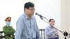 Blogger and former journalist Truong Duy Nhat is seen during his trial at a court in Hanoi, March 9, 2020. 