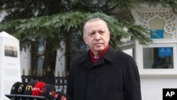 FILE - Turkey's President Recep Tayyip Erdogan speaks to the media after Friday prayers, in Istanbul, Jan. 15, 2021. 