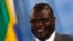 Backers of South Sudan's ex-Vice President Riek Machar, shown here speaking to reporters at the U.N. in July, say they are ready to meet with President Salva Kiir in Addis Ababa -- but insist that one condition be met. 