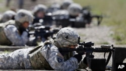 FILE - Coalition forces train at NATO centers in Afghanistan. Islamic State fighters are losing their hold in the country, a United States military spokesman said Thursday.