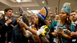Young native Americans vie for a glimpse of first lady Michelle Obama, after she spoke at the first White House Tribal Youth Gathering, July 9, 2015 in Washington. 