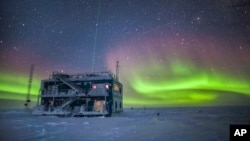 FILE - An NOAA photo shows aurora australis near the South Pole Atmospheric Research Observatory in Antarctica. When a hole in the ozone formed over Antarctica, countries around the world in 1987 agreed to phase out several ozone-depleting chemicals.
