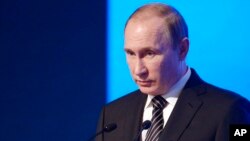 Russian President Vladimir Putin speaks at a meeting of the Russian Chamber of Commerce in Moscow, Russia, Tuesday, March 1, 2016.