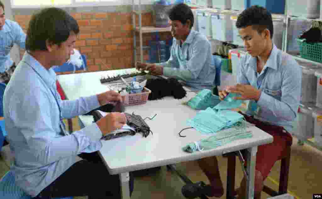 Nearly all those who apply for jobs at Pactics are young women, but there are some male employees, as well. (S. Herman/VOA)