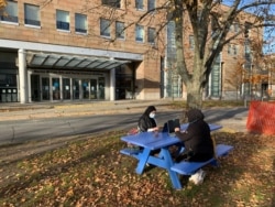 Students enjoy the last days of nice weather on Dalhousie University campus in Halifax, Canada. (Jay Heisler/VOA)