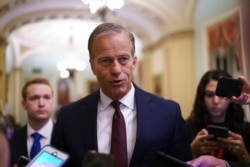 FILE - Senate Minority Whip John Thune, R-S.D., speaks to reporters at the Capitol in Washington, June 23, 2021.