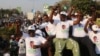 FILE - Supporters of Edgar Lungu, leader of the Patriotic Front, celebrate after Lungu narrowly won re-election, in a vote that rival Hakainde Hichilema rejected on claims of alleged rigging by the electoral commission, in Lusaka, Zambia, Aug. 15, 2016.