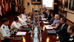 Philippine and U.S. negotiators discussing U.S. troop presence in the Philippines are seen meeting at the Department of National Defense headquarters in Quezon city, north of Manila, in this August 14, 2013, file photo. 