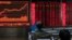 Investors monitor stock prices at a brokerage in Beijing, Jan. 16, 2020. Share prices are mixed in moderate trading in Asia after the U.S. and China signed a preliminary trade agreement.