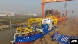 This photo taken on Nov. 3, 2017 shows the ship 'Tian Kun Hao' being launched at a port in Qidong in China's eastern Jiangsu province.