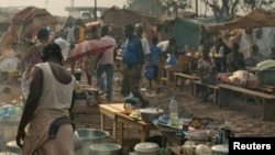 People are seen in a camp for internally dispersed persons at the airport of Bangui, Jan. 19, 2014. 