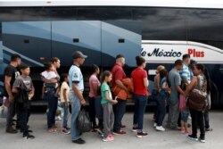 Central American migrants prepare to board a bus as they voluntarily return to their countries, in Ciudad Juarez, Mexico, July 2, 2019.