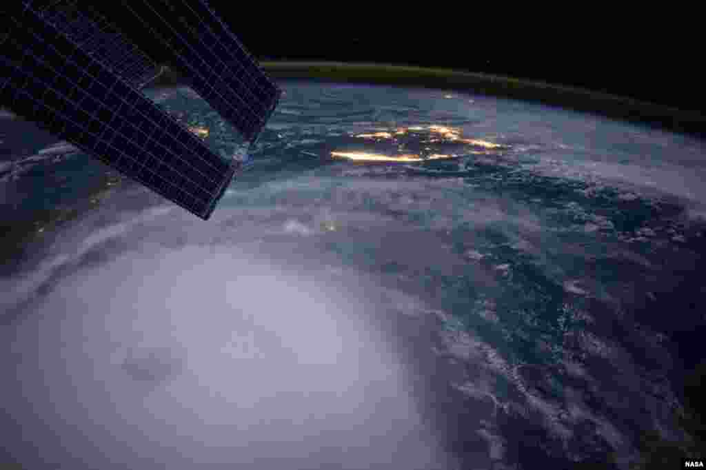 Hurricane Joaquin is seen over the Bahamas in a photo taken by astronaut Scott Kelly from the International Space Station. The Category 4 storm pounded the Bahamas for a second day with powerful winds and waves on Friday, but it was not expected to be a major threat to the U.S. East Coast.