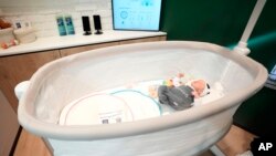The Bosch Revol Smart Crib is displayed at a Bosch booth during the CES tech show in Las Vegas, Jan. 8, 2025.