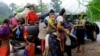FILE - Ethnic Karen have abandoned a camp and villages in eastern Burma to seek refuge in Thailand following government attacks on ethnic insurgents.