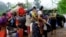 FILE - Ethnic Karen have abandoned a camp and villages in eastern Burma to seek refuge in Thailand following government attacks on ethnic insurgents.
