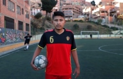 Amateur soccer player Aldair Hermoso poses for a portrait on the field La Paz, Bolivia, Sept. 24, 2019.