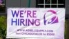 FILE - A hiring sign is displayed outside a restaurant during the COVID-19 pandemic in Glenview, Ill., May 8, 2021. 