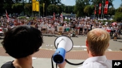 People gather for a rally near the Belarus Television headquarters in Minsk, Belarus, Aug. 17, 2020. 