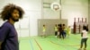 Volunteer Nabil Fallah from Molenbeek offers basketball training to young kids from his neighborhood in Brussels, Belgium, September 2016. (M. van der Wolf/VOA)