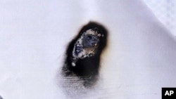 In this March 20, 2017 photo released by Mahaska County Sheriff's Office, burned damage on the pipeline at an above-ground safety valve site southeast of Des Moines near Oskaloosa, Iowa is seen. Authorities in South Dakota and Iowa on Tuesday confirmed incidents of vandalism against the Dakota Access oil pipeline in which someone burned a hole through an empty section of pipe. 