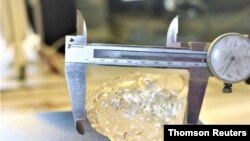 A 1,098-carat diamond, discovered in Botswana and believed to be the third-largest gem-quality stone ever to be mined, is seen in this undated handout picture received June 16, 2021. (Debswana Diamond Company via Reuters)