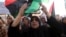 FILE - Women take part in a demonstration against the country's parliament and in support of the coalition of fighters called the Benghazi Revolutionaries Shura Council, at Freedom Square, Benghazi, Aug. 29, 2014.