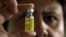 FILE - A bottle containing yellow fever vaccine.